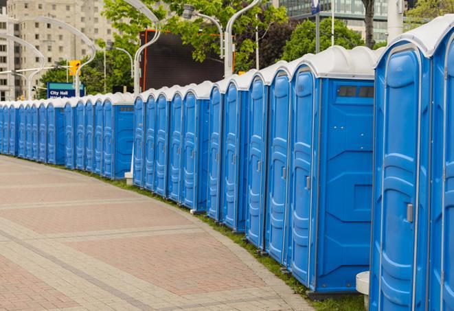 a row of portable restrooms at an outdoor special event, ready for use in Bellaire TX